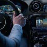 Jaguar interior with driver using Jaguar incontrol apps