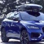 blue 2019 jaguar f-pace with roof bars and roof box
