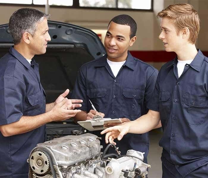 Mechanics talking about fixing a car