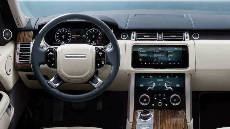 Tan Range Rover dashboard and steering wheel