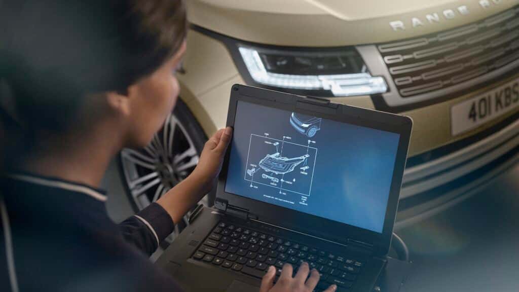 Land Rover Technician Examining a Range Rover 