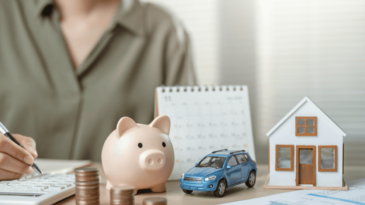 A person calculating their car payments