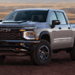 Front and side view of the 2027 Chevrolet Silverado 1500 in an off-road setting