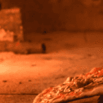 pizza in a wood burning oven