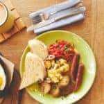 Early meal with fried eggs served with coffee