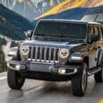 2019 Jeep Wrangler Towing a Boat Through the Mountains