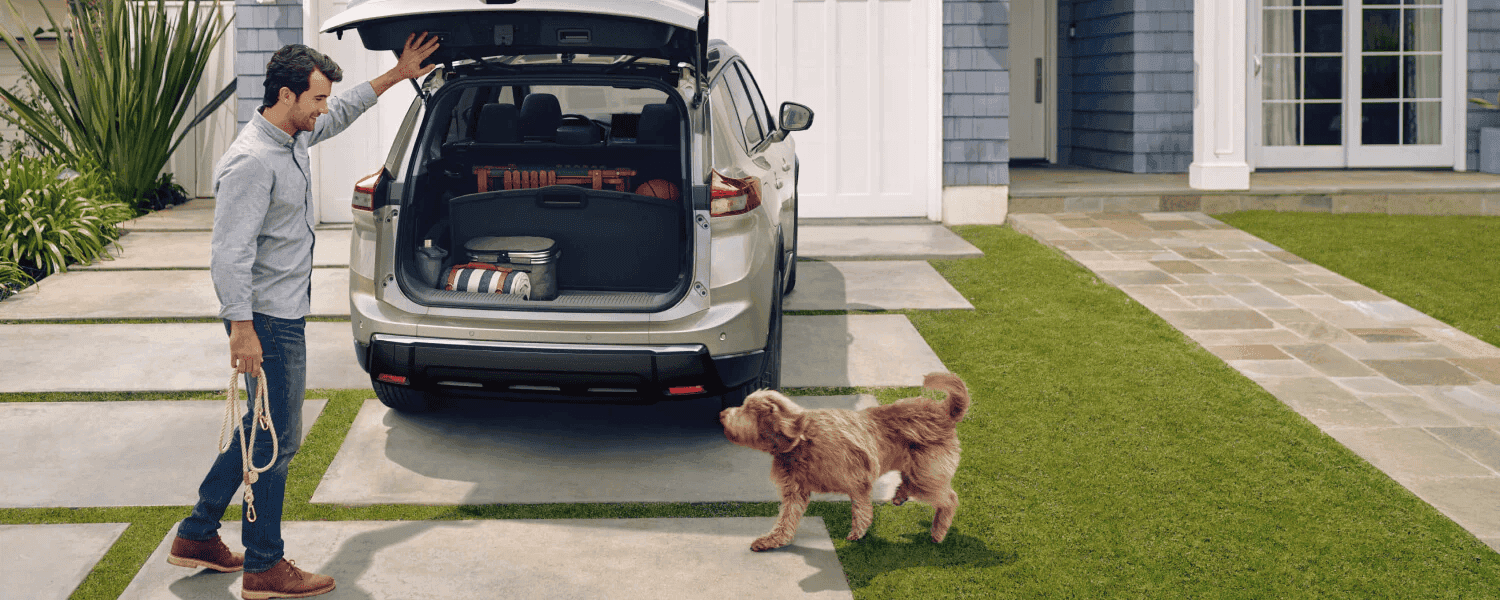 2025 Nissan Rogue with man and dog