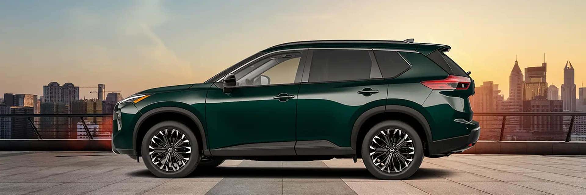 2026 nissan rogue parked in front of city skyline