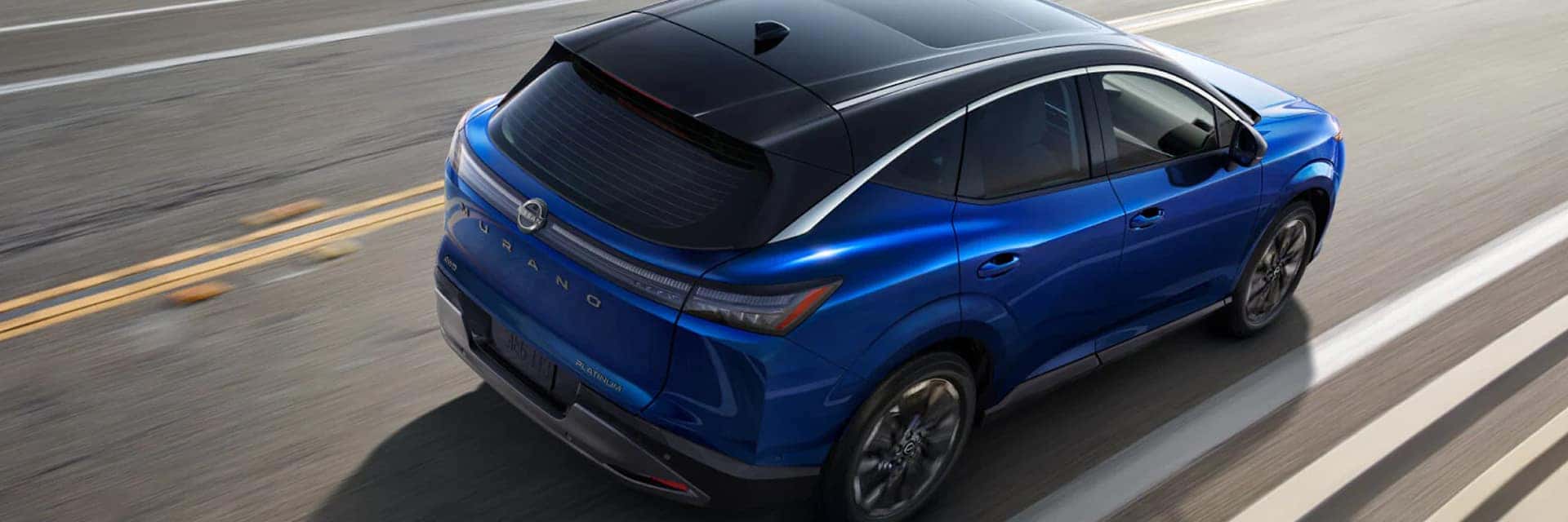 blue nissan murano driving on road