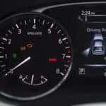Nissan dashboard displaying warning lights and driver-assistance indicators