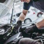 mechanic working on mazda car