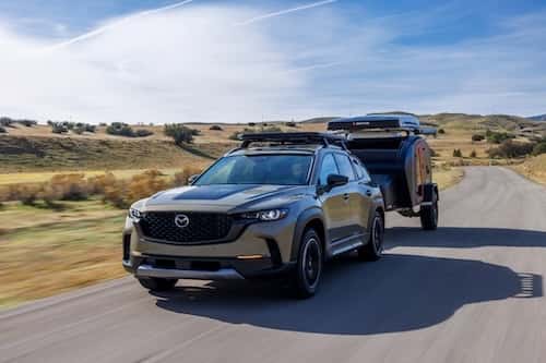 Mazda CX-50 demonstrating towing capability during a road trip
