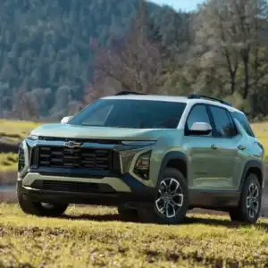 2026 Chevrolet Equinox Cacti Green with Summit White roof parked on grass