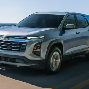 2026 Chevrolet Equinox LT Sterling Gray Metallic driving past water