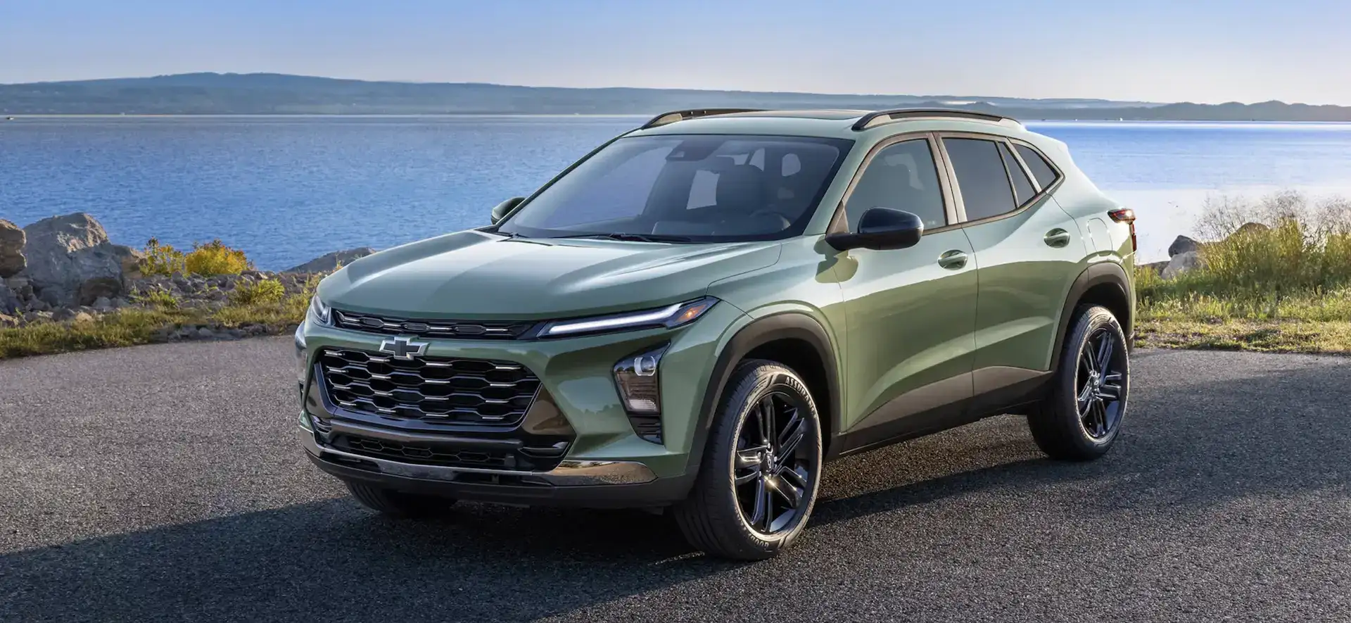 2026 Chevrolet Trax Cacti Green next to a lake