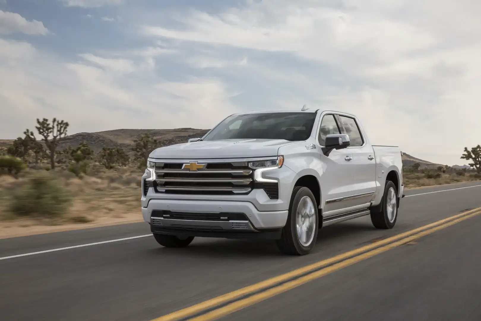 Chevrolet Silverado 1500 High Country driving on a desert road