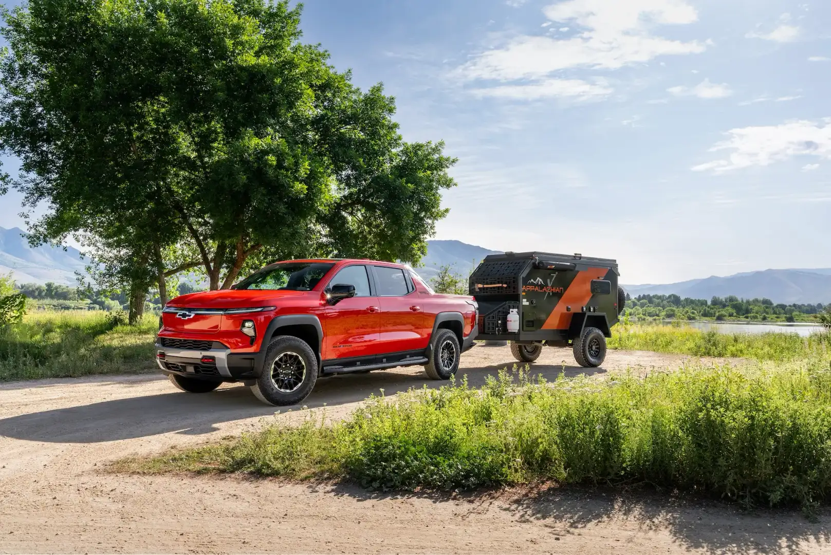 Chevrolet Silverado EV Trail Boss towing a camper trailer