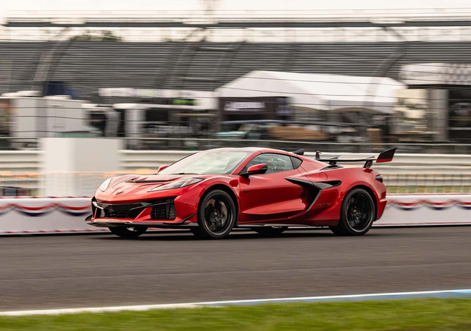 A Resilient And Patriotic Red Chevy Corvette, Speeding On The Indianapolis Speedway