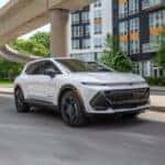 The Attractive 2026 Chevrolet Equinox EV, Cruising Through A Cityscape In Sunny Weather