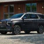 The Spacious And Family Friendly 2026 Chevrolet Tahoe, Parked Outside A Family's Home