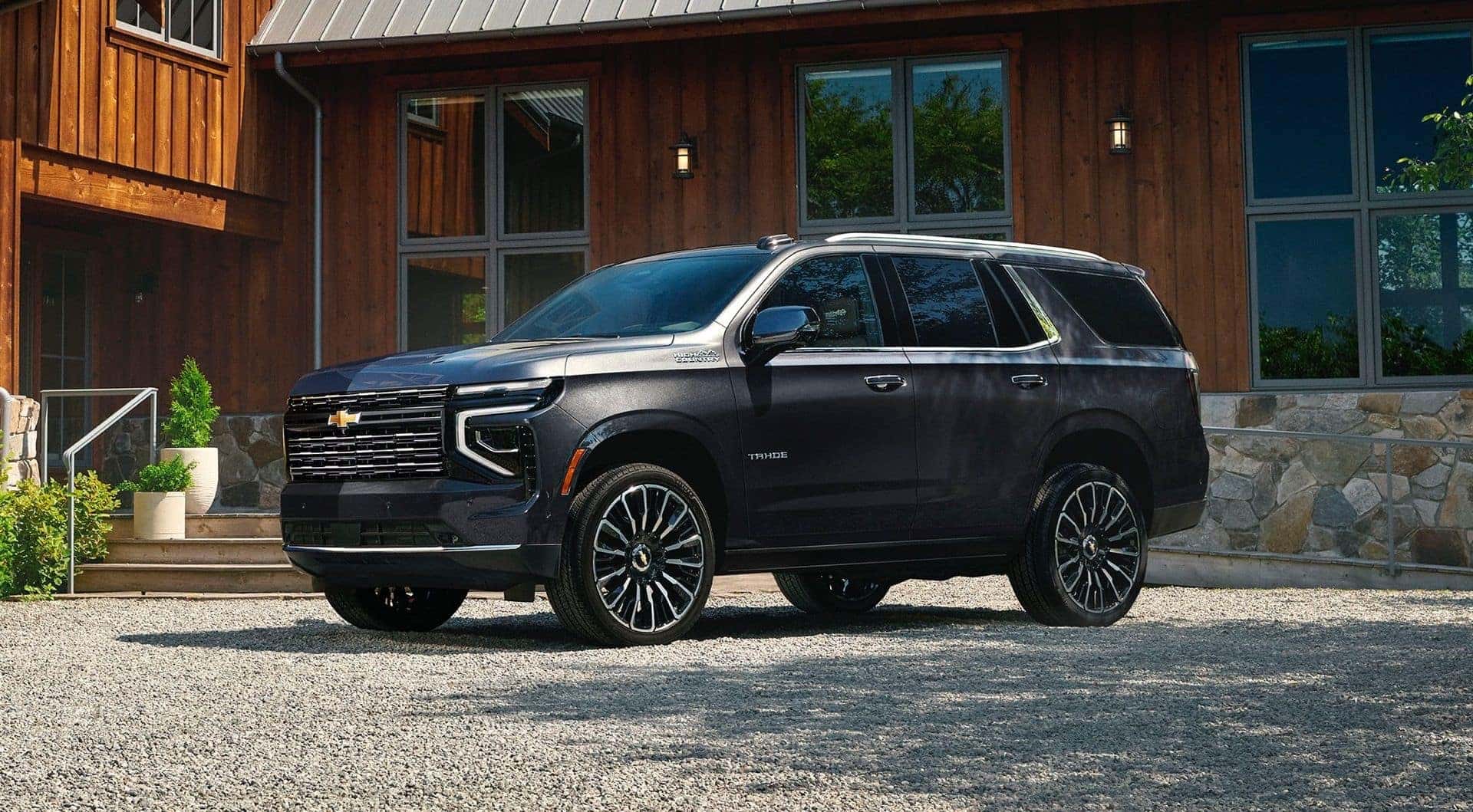 The Spacious And Family Friendly 2026 Chevrolet Tahoe, Parked Outside A Family's Home