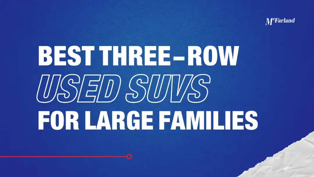 Large family loading a used three-row Chevy Traverse with gear