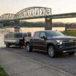 2026 Chevrolet Silverado 1500 backing a pontoon boat trailer toward the Ohio River boat ramp at Maysville River Park in Kentucky
