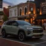 2026 Chevrolet Equinox parked on a historic downtown Maysville Kentucky street near an evening event venue