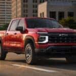 2027 Chevrolet Silverado 1500 on a Kentucky highway in autumn