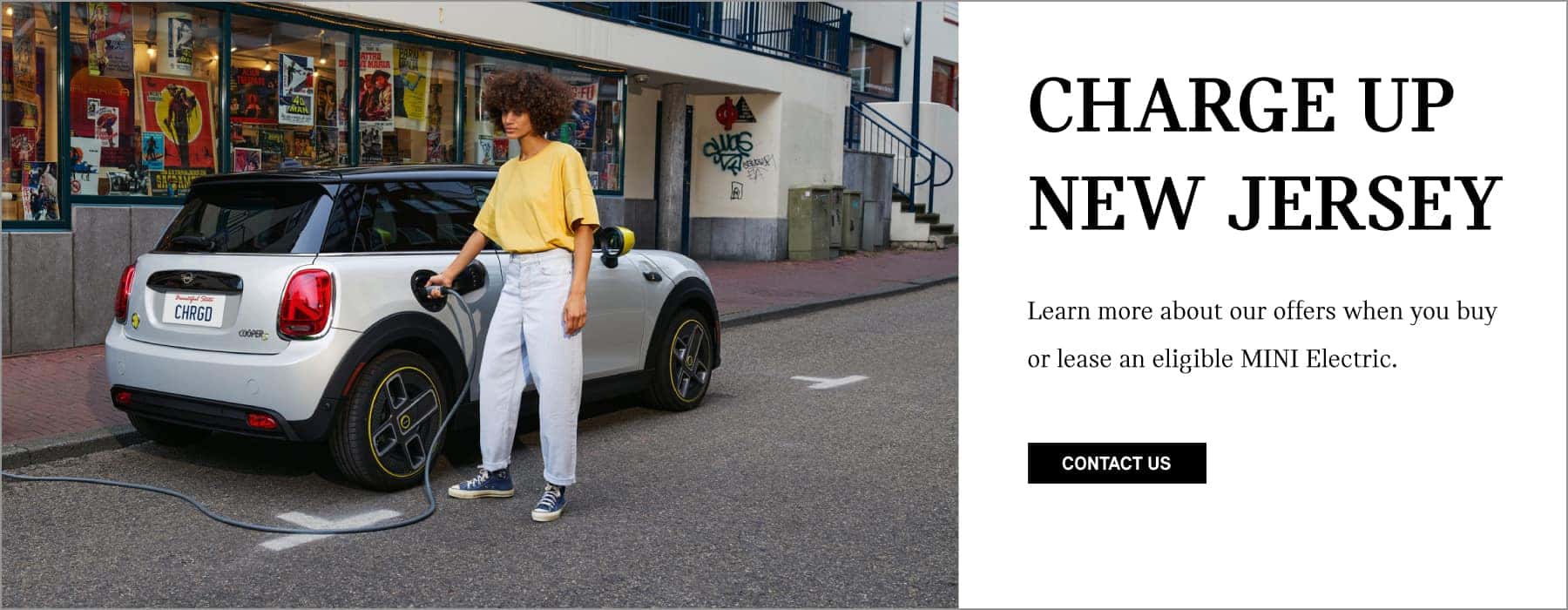 Charge up New Jersey. Click to contact us and hear about our offers on Electric Vehicles. Pictured is a MINI getting charged on a city street.