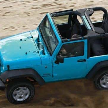 2017 Jeep Wrangler driving on sand