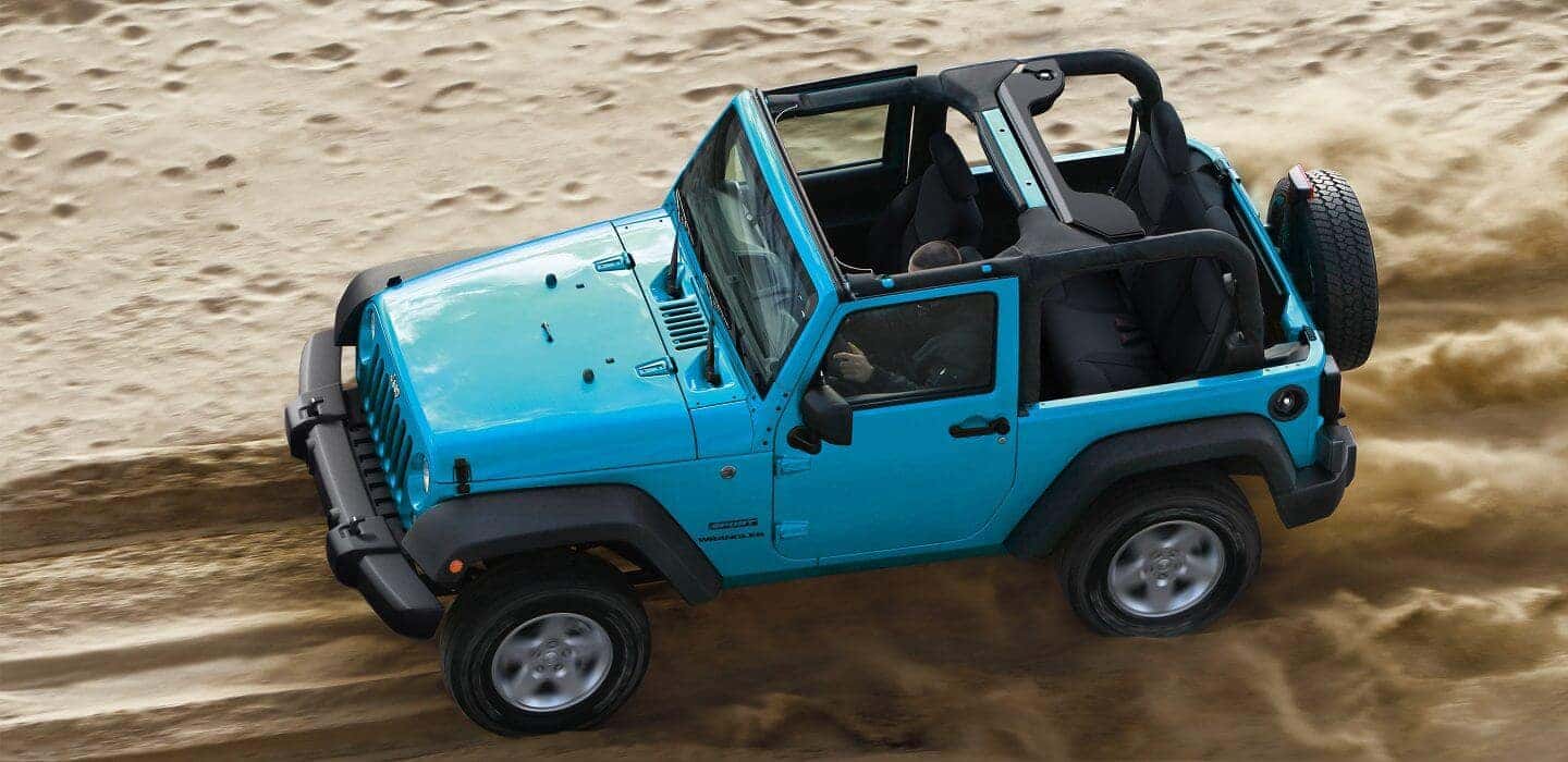 2017 Jeep Wrangler driving on sand