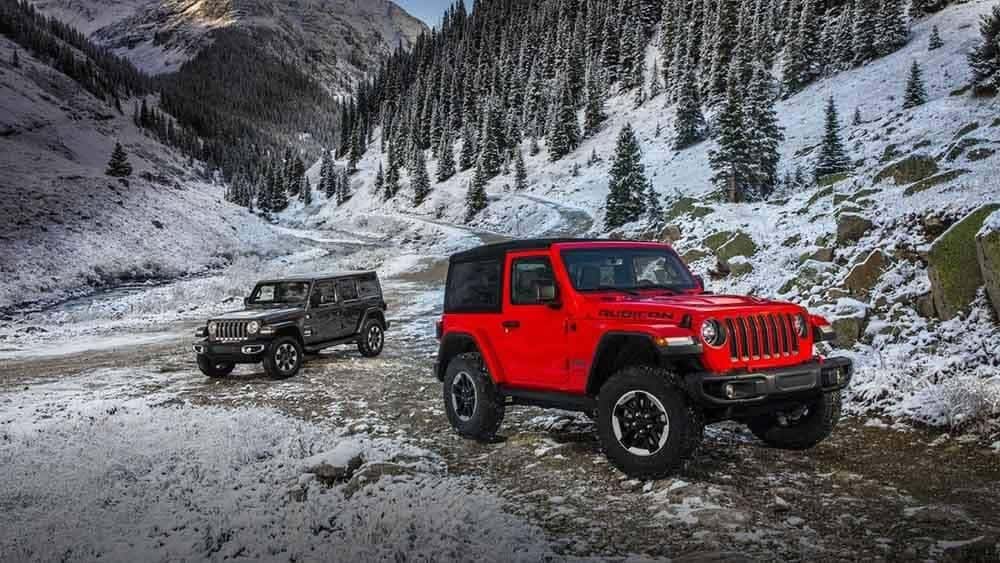 2018 Jeep Wrangler Models Parked at Bottom of Mountains
