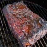 A large piece of meat on a grill