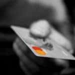 A person holding a credit card