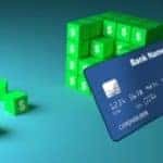 A set of green blocks next to a credit card