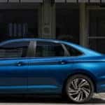 2019 VW Jetta parked outside of storefront window