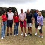 An image displaying some golfers and some of the Preston Hood Chevrolet staff enjoying the golf tournament.