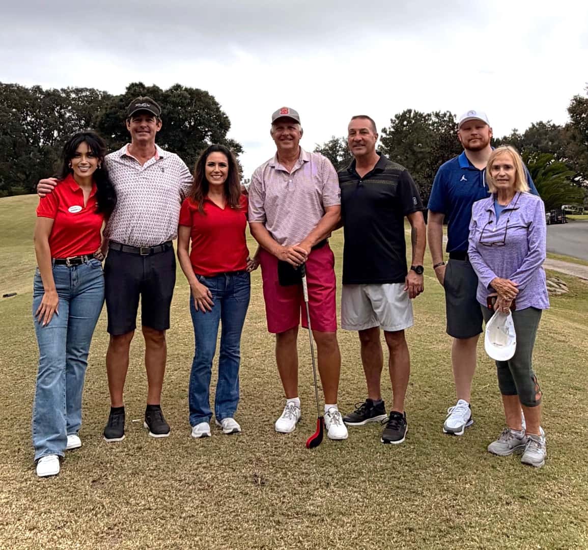 An image displaying some golfers and some of the Preston Hood Chevrolet staff enjoying the golf tournament.