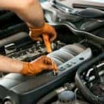 Mechanic working on a car engine