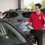 Customer speaking with salesperson at a Toyota dealership