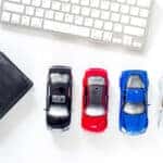 Toyota financing materials laid out near a keyboard