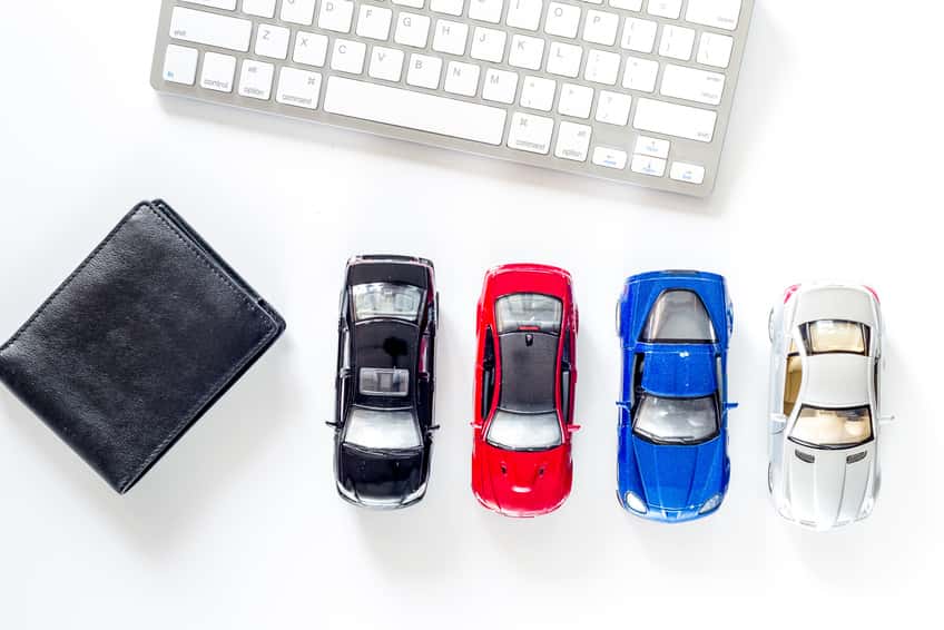 Toyota financing materials laid out near a keyboard