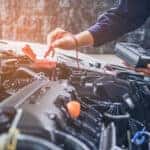 Toyota service technician running diagnostics on a car