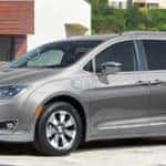 Silver 2019 Chrysler Pacifica parked in residential driveway