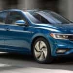 Blue 2019 Volkswagen Jetta driving down highway