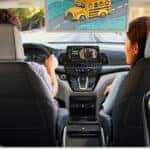2026 Honda Odyssey Interior with Technology and Family Seated