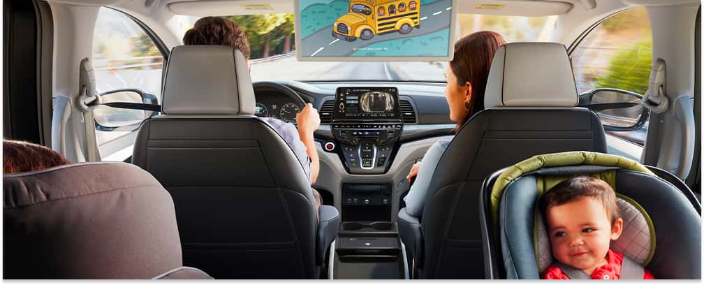 2026 Honda Odyssey Interior with Technology and Family Seated