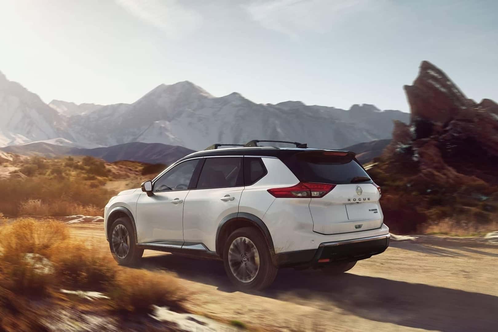 nissan rogue next to mountains