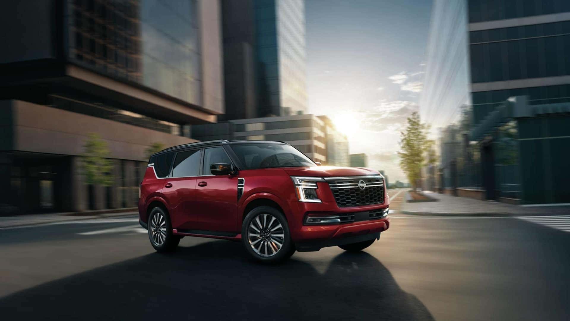 2026 nissan armada driving down a city street